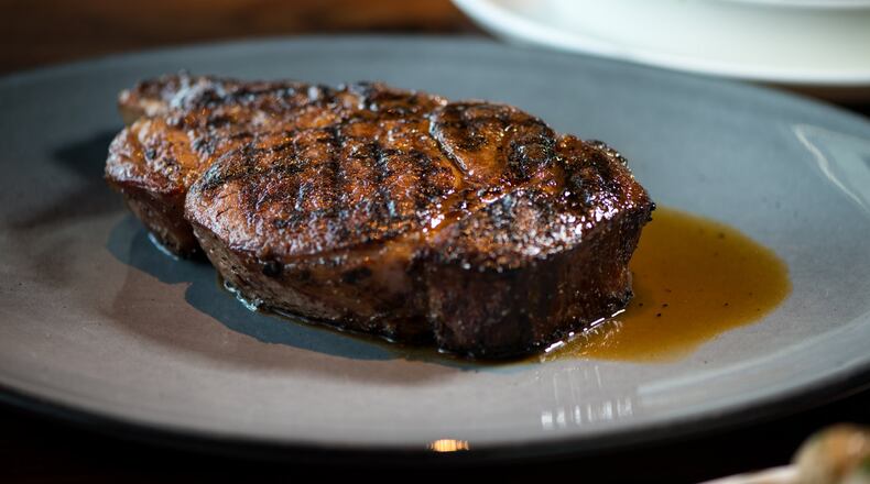 Kaiser’s Chophouse Prime Cowboy Ribeye is 20-ounces of dry-aged, bone-in steak. Photo credit- Mia Yakel.