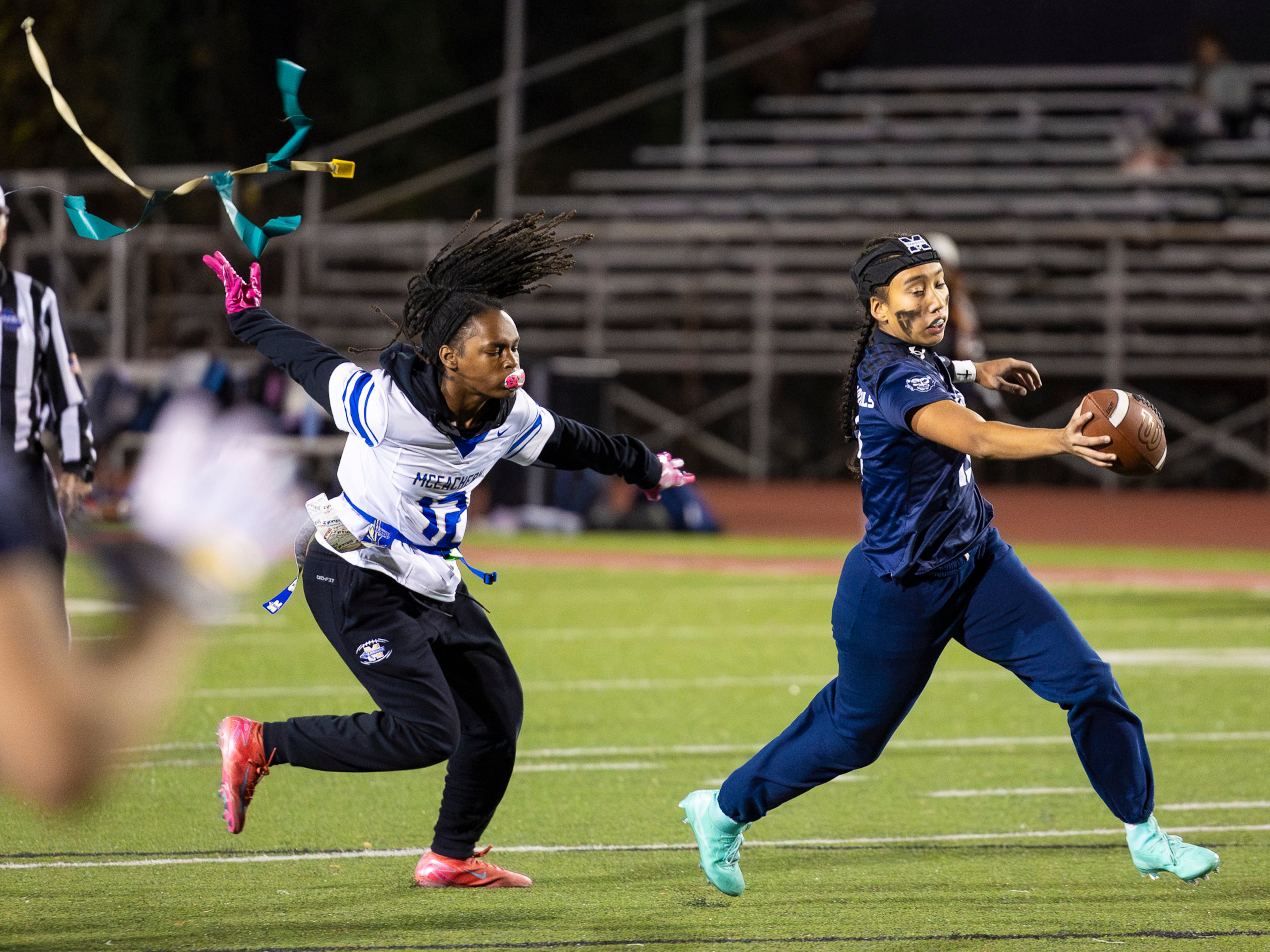 Marietta's Kaylee Wang (right) gets her flag pulled in a flag football game against McEachern at Osborne High School in Marietta, GA on Monday, November 17th, 2025. (Oscar Guevara Saenz for the AJC)