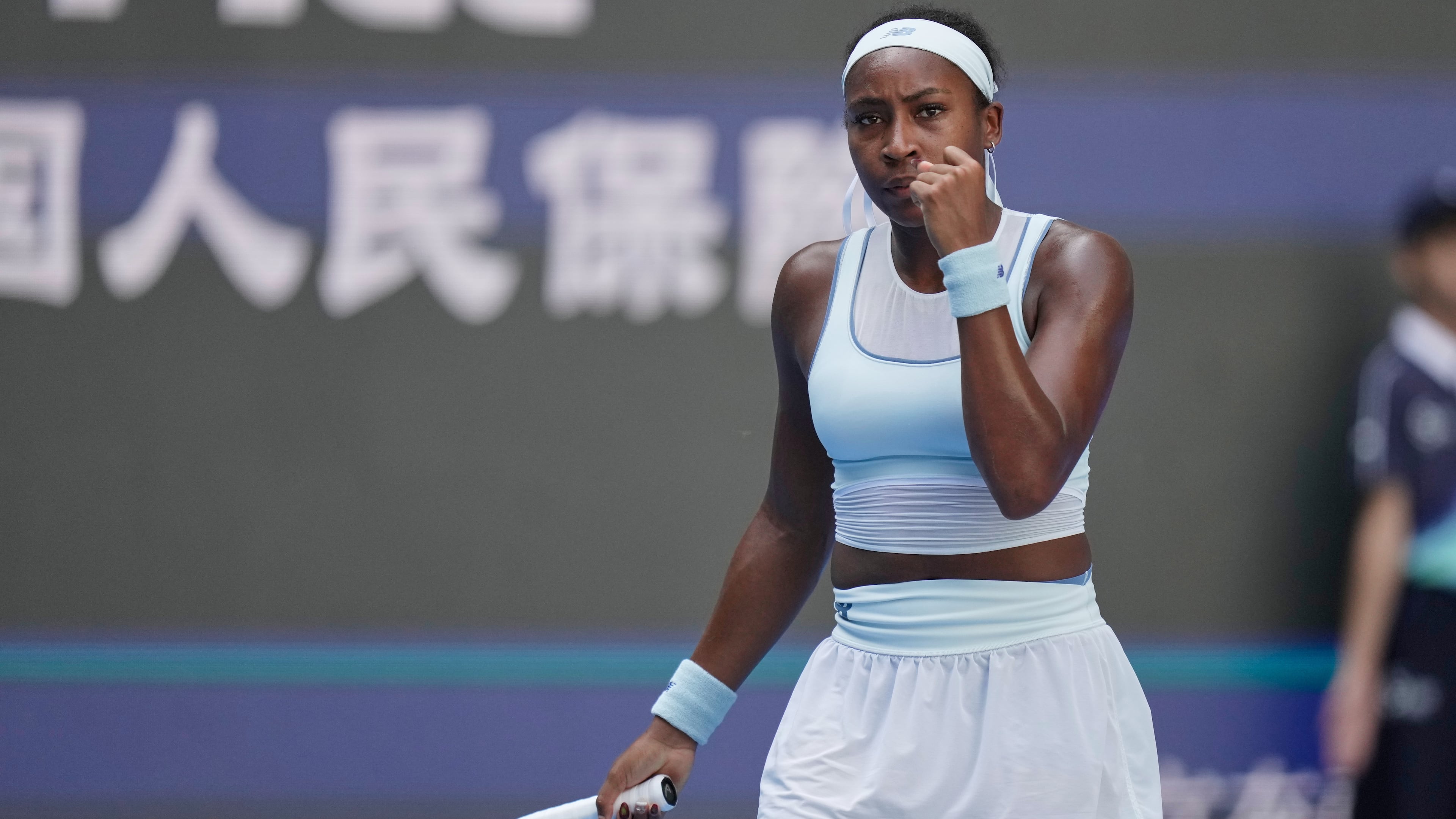 Coco Gauff of the United States reacts after scoring a point against Belinda Bencic of Switzerland during a women's singles match of the China Open tennis tournament, in Beijing, China, Tuesday, Sept. 30, 2025. (AP Photo/Mahesh Kumar A.)