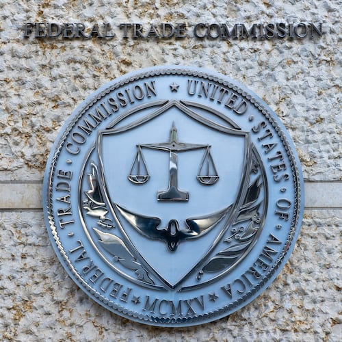 FILE - The official seal of the Federal Trade Commission is seen on an office building in Washington, Feb. 13, 2026. (AP Photo/Cliff Owen, File)