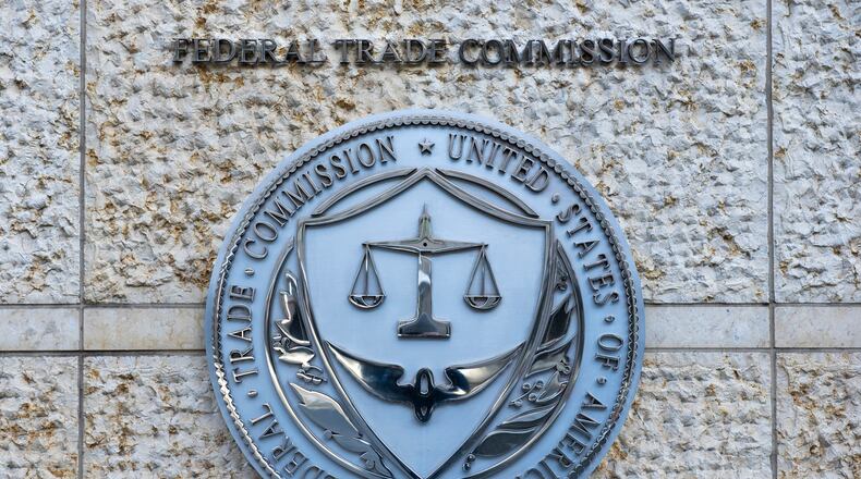 FILE - The official seal of the Federal Trade Commission is seen on an office building in Washington, Feb. 13, 2026. (AP Photo/Cliff Owen, File)