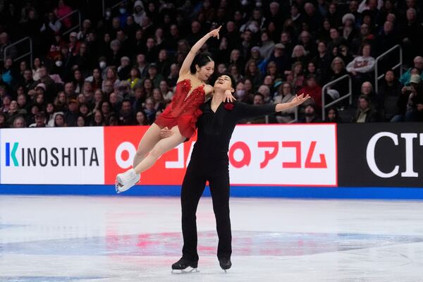 Riku Miura and Ryuichi Kihara, of Japan, perform during the pairs free skating program at the figure skating world championships, Thursday, March 27, 2025, in Boston. (AP Photo/Charles Krupa)