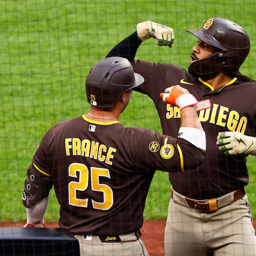 San Diego Padres' Fernando Tatis Jr. celebrates with Ty France (25) after hitting a home run against the New York Mets during the first inning of a baseball game, Tuesday, Aug. 18, 2026, in New York. (AP Photo/Noah K. Murray)