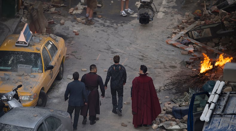 Cast members Mark Ruffalo Robert Downey Jr., Benedict Wong and Benedict Cumberbatch work during the filming of "Avengers: Infinity Wars, Monday, June 26, 2017, in Atlanta. The set is modeled after a New York City street. (AP Photo/Mike Stewart)