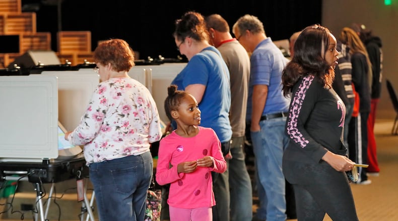 A steady steam of people vote at the Noonday Baptist Church in Marietta on Tuesday, Nov. 6, 2018.