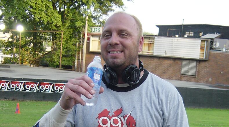 Chris 'Crash' Clark, 99X/Q100 traffic reporter, takes a break from dodging paintballs Friday morning during a radio contest spoof of the recent 'Hunting for Bambi' hoax out of Vegas,. That was where men were supposedly paying to shoot naked women with paintballs, then having sex with them. (8/1/03)