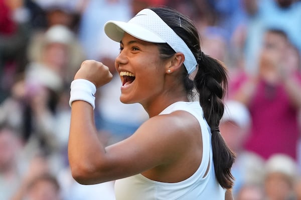 Emma Raducanu of Britain celebrates winning the second round women's singles match against Marketa Vondrousova of the Czech Republic at the Wimbledon Tennis Championships in London, Wednesday, July 2, 2025.(AP Photo/Kirsty Wigglesworth)
