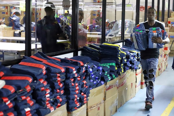FILE -A factory worker arranges garments at United Aryan EPZ Limited in Ruaraka on the outskirts of Nairobi, Kenya, March 21, 2025. (AP Photo/Andrew Kasuku, File)