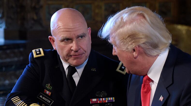 President Donald Trump, right, shakes hands with Army Lt. Gen. H.R. McMaster, left, at Trump's Mar-a-Lago estate in Palm Beach, Fla., Monday, Feb. 20, 2017, where he announced that McMaster will be the new national security adviser. (AP Photo/Susan Walsh)
