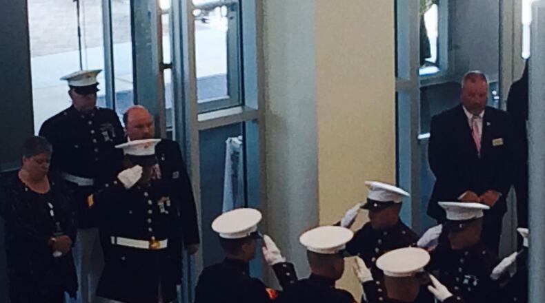 Marines salute Lance Cpl. Skip Wells' flag-draped coffin. Photo: Jennifer Brett