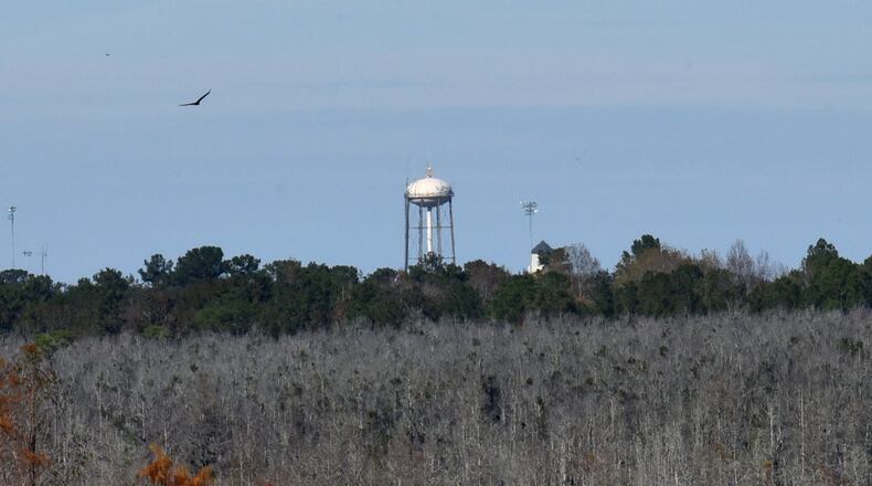 Moody AFB water tower is visible from Grand Bay Boardwalk observation tower near Valdosta. All three of Georgia’s air force bases have recorded high levels of toxic chemicals in groundwater, raising concerns about the impact to the ecologies of the state’s wetlands and the people who recreate there. HYOSUB SHIN / HSHIN@AJC.COM