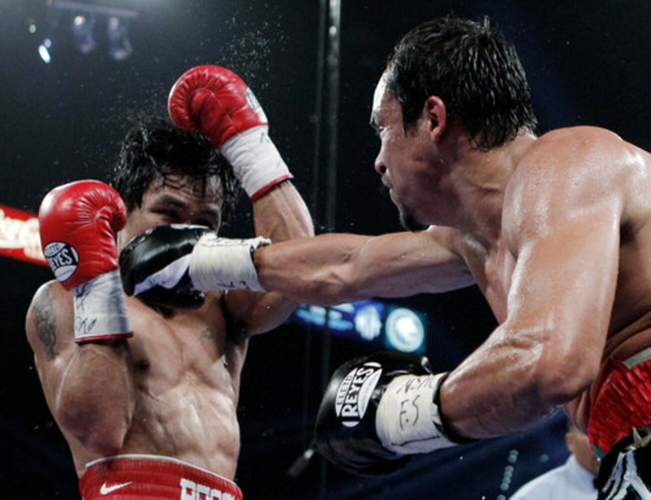 Manny Pacquiao defeats Juan Manuel Marquez