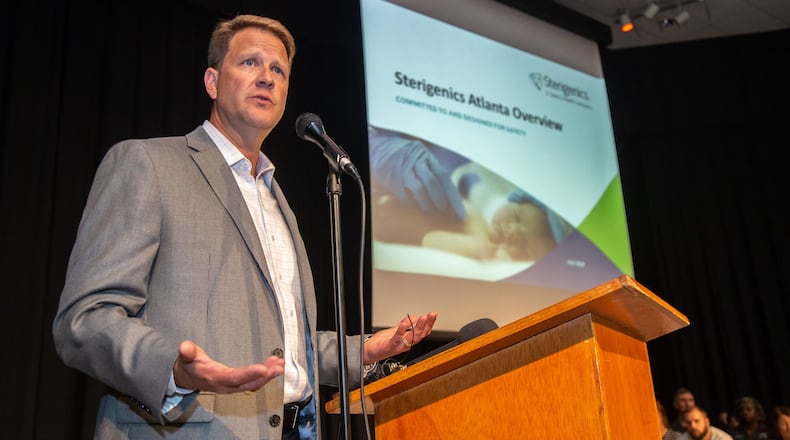 Sterigenics President Philip Macnabb talks to a packed house during a community meeting in Cobb County to address concerns over toxic emissions from the plant. The company announced Monday that it is closing a similar plant in Willowbrook, Illinois, following a year of sustained opposition from residents and officials in that state. STEVE SCHAEFER / SPECIAL TO THE AJC