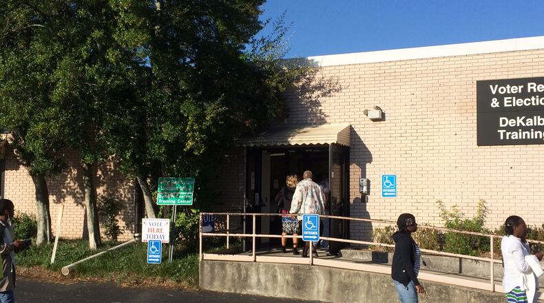 People walk into the DeKalb County elections office Monday to vote. JOSHUA.SHARPE/JOSHUA.SHARPE@AJC.COM