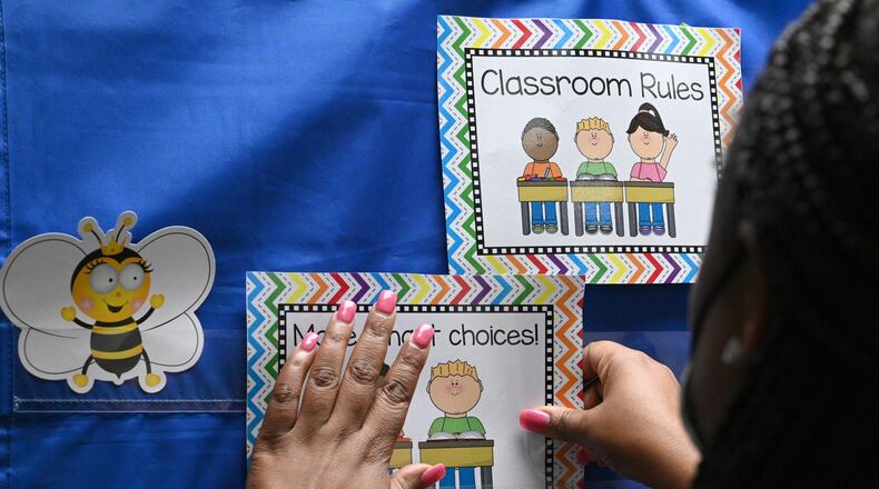 An Anderson-Livsey Elementary School teacher prepares her classroom on July 28, 2022. The school was recognized as a literacy leader by the Georgia Department of Education for its improvement in reading. It was among eight schools in Gwinnett County to receive the recognition. (Hyosub Shin / Hyosub.Shin@ajc.com)