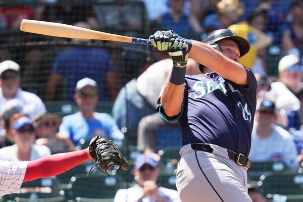 Seattle Mariners' Cal Raleigh hits a single during the fifth inning of a baseball game against the Chicago Cubs in Chicago, Sunday, June 22, 2025. (AP Photo/Nam Y. Huh)