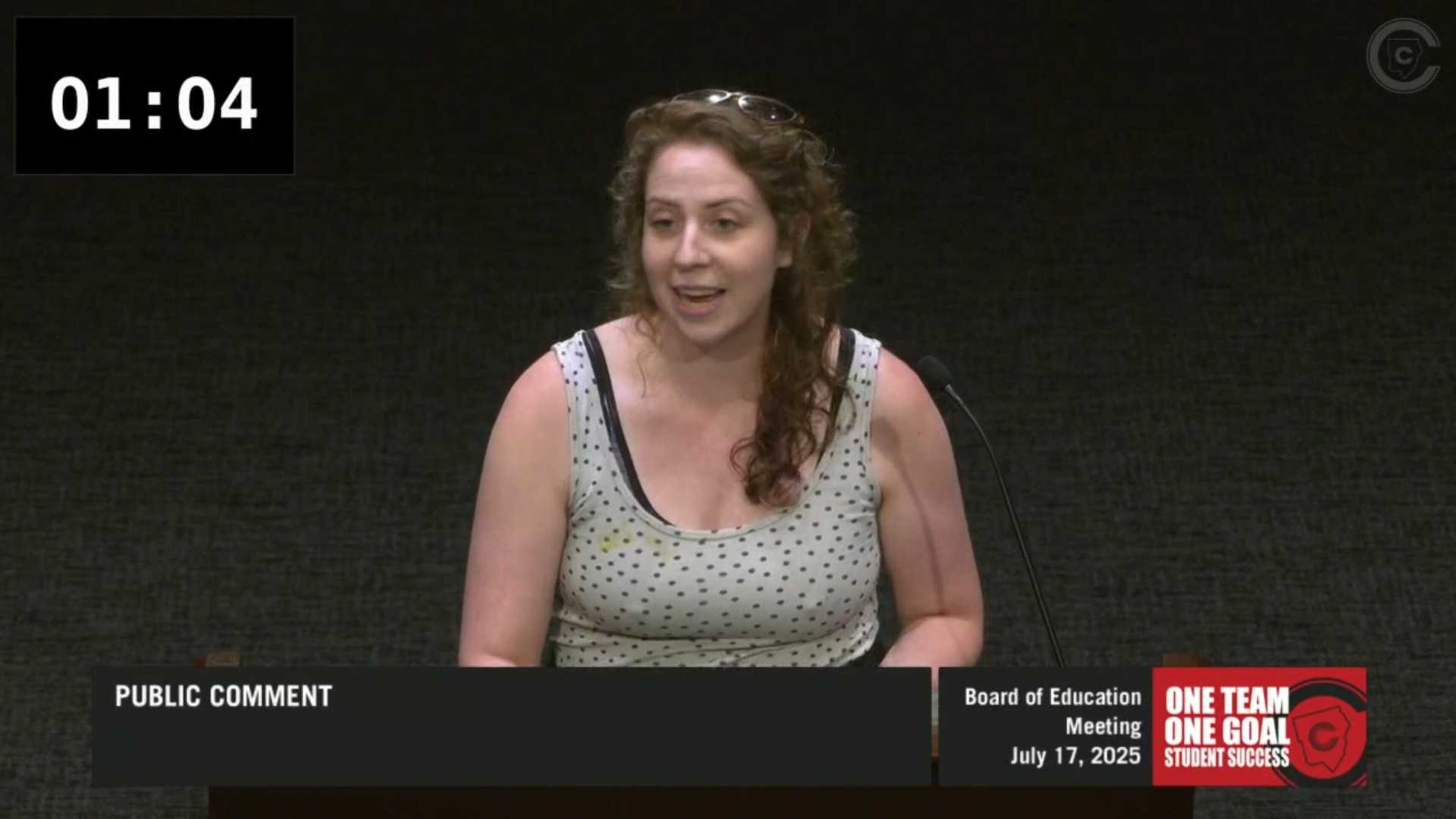 Cobb County parent Melissa Hagen speaks at the July 2025 school board meeting against a plan to stop livestreaming public comments during their meetings. (Cobb County School District)