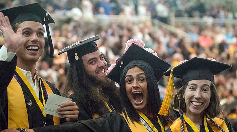 05/09/2019  -- Kennesaw, Georgia -- Kennesaw State University graduates get excited before walking across the stage and receiving their degrees during the 223rd Kennesaw State University commencement ceremony at the convocation center on the university's main campus in Kennesaw, Thursday, May 9, 2019. (ALYSSA POINTER/ALYSSA.POINTER@AJC.COM)