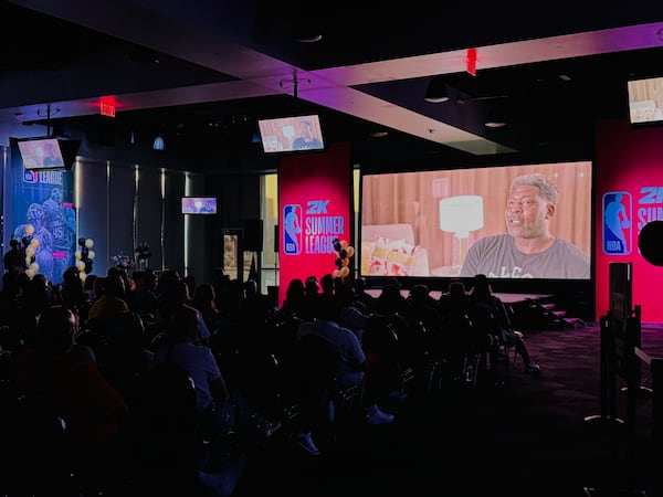 A clip of retired NBA player Larry Johnson speaking from "UNLV: Runnin' Rebels" documentary during the Summer League Film Festival, Saturday, July 19, 2025, in Las Vegas. (AP Photo/Jonathan Landrum)