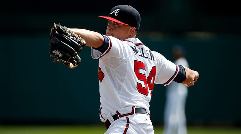 Atlanta Braves starting pitcher Kris Medlen (54) warms up from the mound before the first inning in a spring exhibition baseball game against the Washington Nationals, Tuesday, March 4, 2014, in Kissimmee, Fla. (AP Photo/Alex Brandon) Braves pitcher Kris Medlen will have his injured elbow examined. (Alex Brandon / AP)