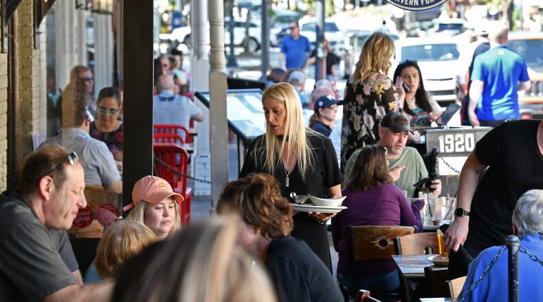 Jenna Aronowitz (center) is pictured greeting guests two years ago at 1920 Tavern restaurant (Hyosub Shin / Hyosub.Shin@ajc.com)