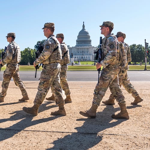 FILE - Armed National Guard soldiers from West Virginia patrol the Mall near the Capitol in Washington, as part of President Donald Trump's order to impose federal law enforcement in the nation's capital, Aug. 26, 2025. (AP Photo/J. Scott Applewhite, File)