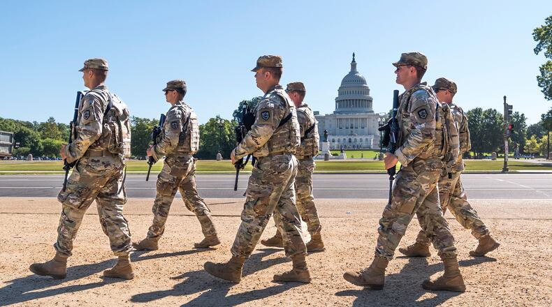 FILE - Armed National Guard soldiers from West Virginia patrol the Mall near the Capitol in Washington, as part of President Donald Trump's order to impose federal law enforcement in the nation's capital, Aug. 26, 2025. (AP Photo/J. Scott Applewhite, File)