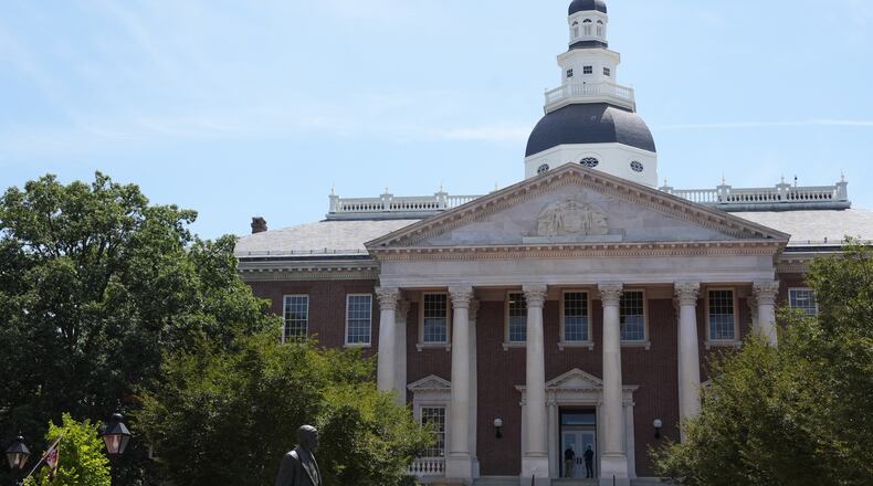 People stand at the doors of the Maryland State House on Tuesday, Aug. 4, 2026, in Annapolis, Md. (AP Photo/Mingson Lau)