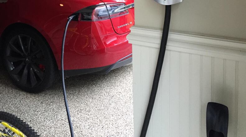 Garages are being built and retrofitted in metro Atlanta to accommodate homeowners with a Tesla models or plans to purchase Teslas or other electric vehicles. Contributed by David Lefkovits, LEFKO Design + Build