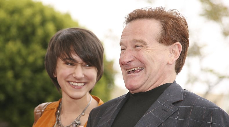 Actor Robin Williams (R) and daughter Zelda pose at the premiere of Columbia Picture's 'RV' at the Village Theater on April 23, 2006 in Los Angeles, California. (Photo by Kevin Winter/Getty Images)