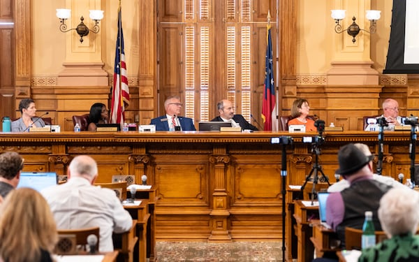 Members of the State Election Board listen to public comment during a meeting at the Georgia State Capitol in Atlanta on Tuesday, August 6, 2024.