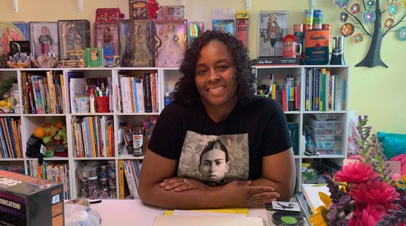 Kim Bryant poses in her home art studio.
Courtesy of Kim Bryant