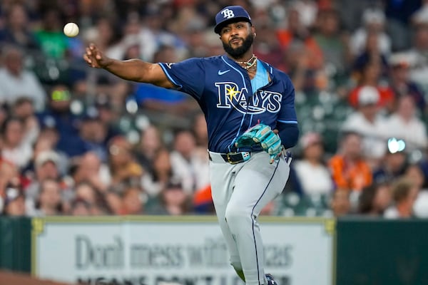 Tampa Bay Rays third baseman Junior Caminero throws out Houston Astros' Jose Altuve to end the fourth inning of a baseball game Friday, May 30, 2025, in Houston. (AP Photo/Eric Christian Smith)
