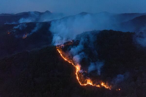 A wildfire spreads on a mountain in Andong, South Korea, Thursday, March 27, 2025. (Kim Do-hun/Yonhap via AP)