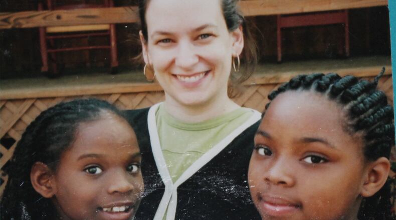 Volunteer tutor Patti Ghezzi with Whitefoord Elementary School students in 2000 at Camp Woodmont in North Georgia. Volunteers raised money in memory of Dr. Betty Blasingame to send children to camp.