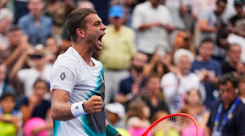 Flavio Cobolli, of Italy, celebrates winning a match against Francisco Comesana, of Argentina, during the first round of the U.S. Open tennis championships, Tuesday, Sept. 1, 2026, in New York. (AP Photo/Seth Wenig)
