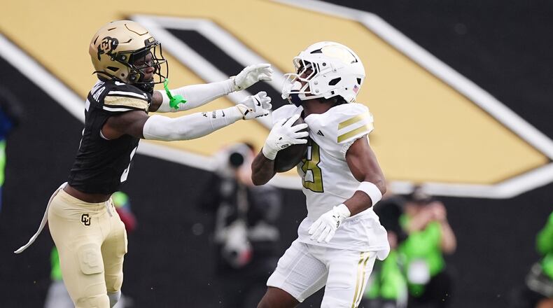 Colorado cornerback RJ Johnson, left, reaches out to stop Georgia Tech wide receiver Malik Rutherford in an NCAA college football game Friday, Aug. 29, 2025, in Boulder, Colo. (David Zalubowski/AP)
