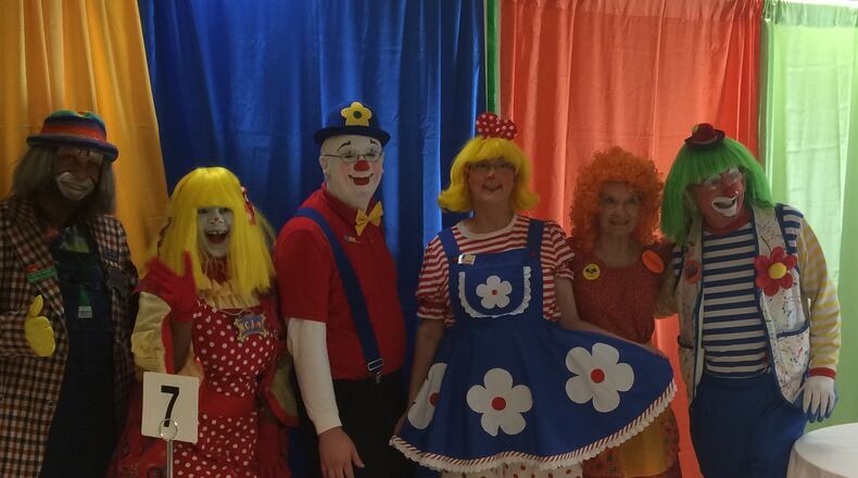 Send in the good, non-creepy clowns! (l-r) Handyman, KC Joy, Popper, Daisy, SonShine and Dont Kno are members of the Peachtree Clown Alley, a longtime club for clowns in metro Atlanta. Photo by Jill Vejnoska/jvejnoska@ajc.com
