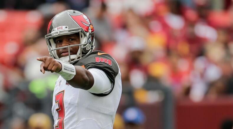 Tampa Bay Buccaneers quarterback Jameis Winston (3) points down the line the during the first half of an NFL football game against the Washington Redskins in Landover, Md., Sunday, Oct. 25, 2015. (AP Photo/Mark Tenally)