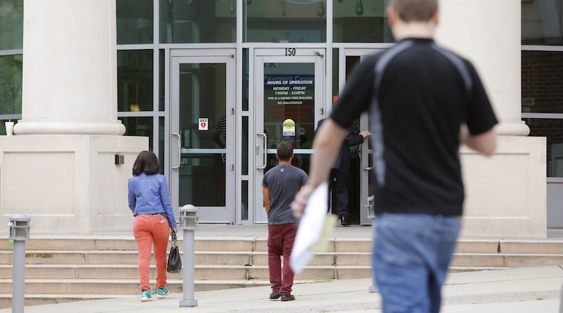 People enter Atlanta Municipal Court of Atlanta this week. Some who go to the court after receiving traffic tickets say it can be a frustrating experience. BOB ANDRES / BANDRES@AJC.COM
