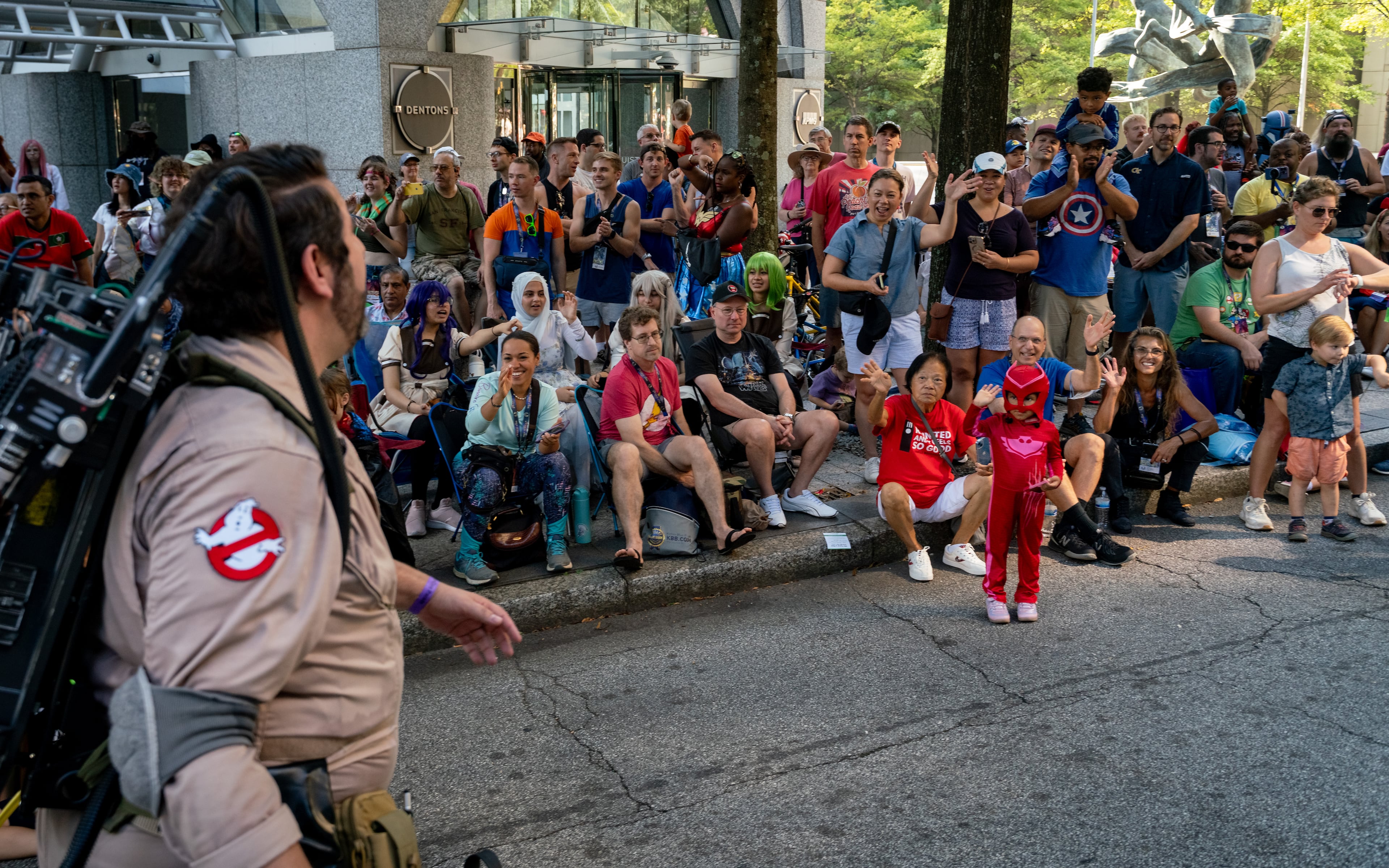 Thousands lined up along Peachtree Street on Saturday morning, August 31, 2024, for the annual Dragon Con parade in Atlanta. For five days, Atlanta is going to be the epicenter of pop culture and an estimated 70,000 people are expected to partake in the annual multi-genre convention. (Ben Hendren for The Atlanta Journal-Constitution)