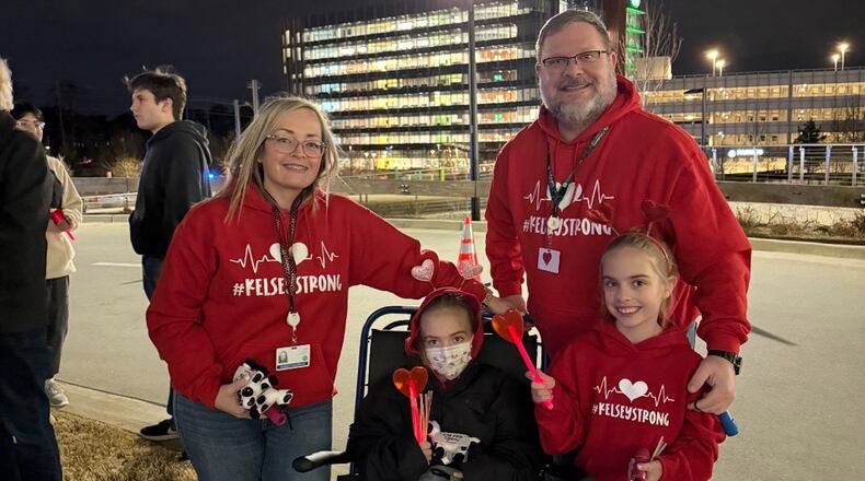 Kelsey Brackett (seated) and her family (from left: Sonja, Zach and Kinsley Brackett) returned to Children's Healthcare of Atlanta Arthur M. Blank Hospital last Valentine's Day for Lights of Love to show support for hospitalized patients and their families. (Courtesy of Sonja Brackett)