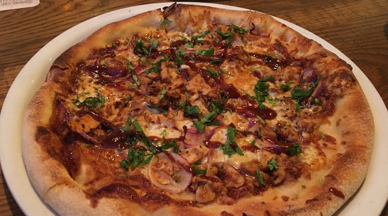 California Pizza Kitchen’s Original BBQ Chicken Pizza is slathered with slices of tender chicken, red onion and barbecue sauce intertwined in smoked gouda cheese.