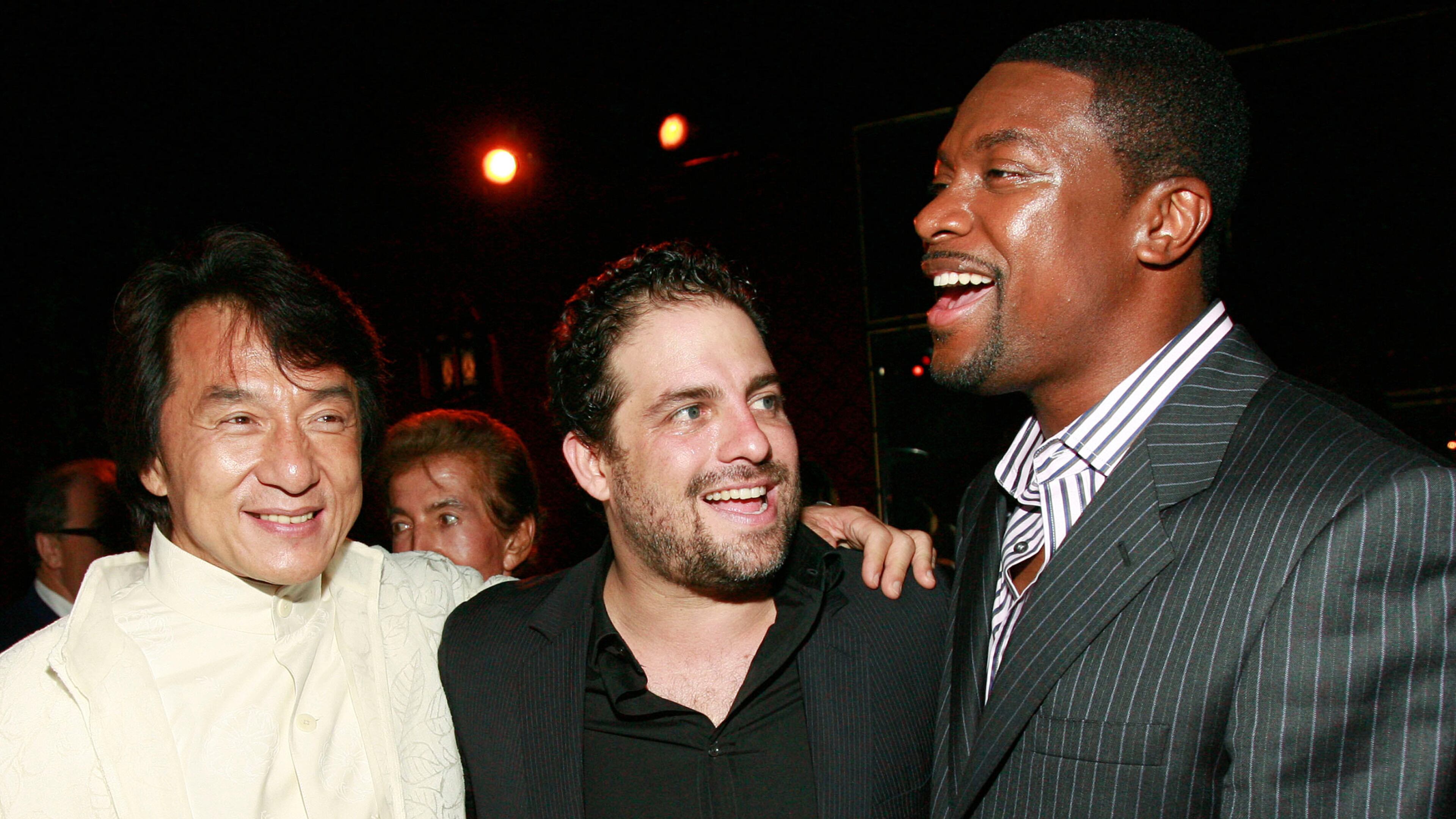 FILE - Jackie Chan, from left, Brett Ratner and Chris Tucker appear at the "Rush Hour 3" premiere after party in Los Angeles on July 30, 2007. (AP Photo/Matt Sayles, File)