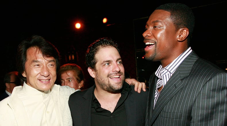 FILE - Jackie Chan, from left, Brett Ratner and Chris Tucker appear at the "Rush Hour 3" premiere after party in Los Angeles on July 30, 2007. (AP Photo/Matt Sayles, File)
