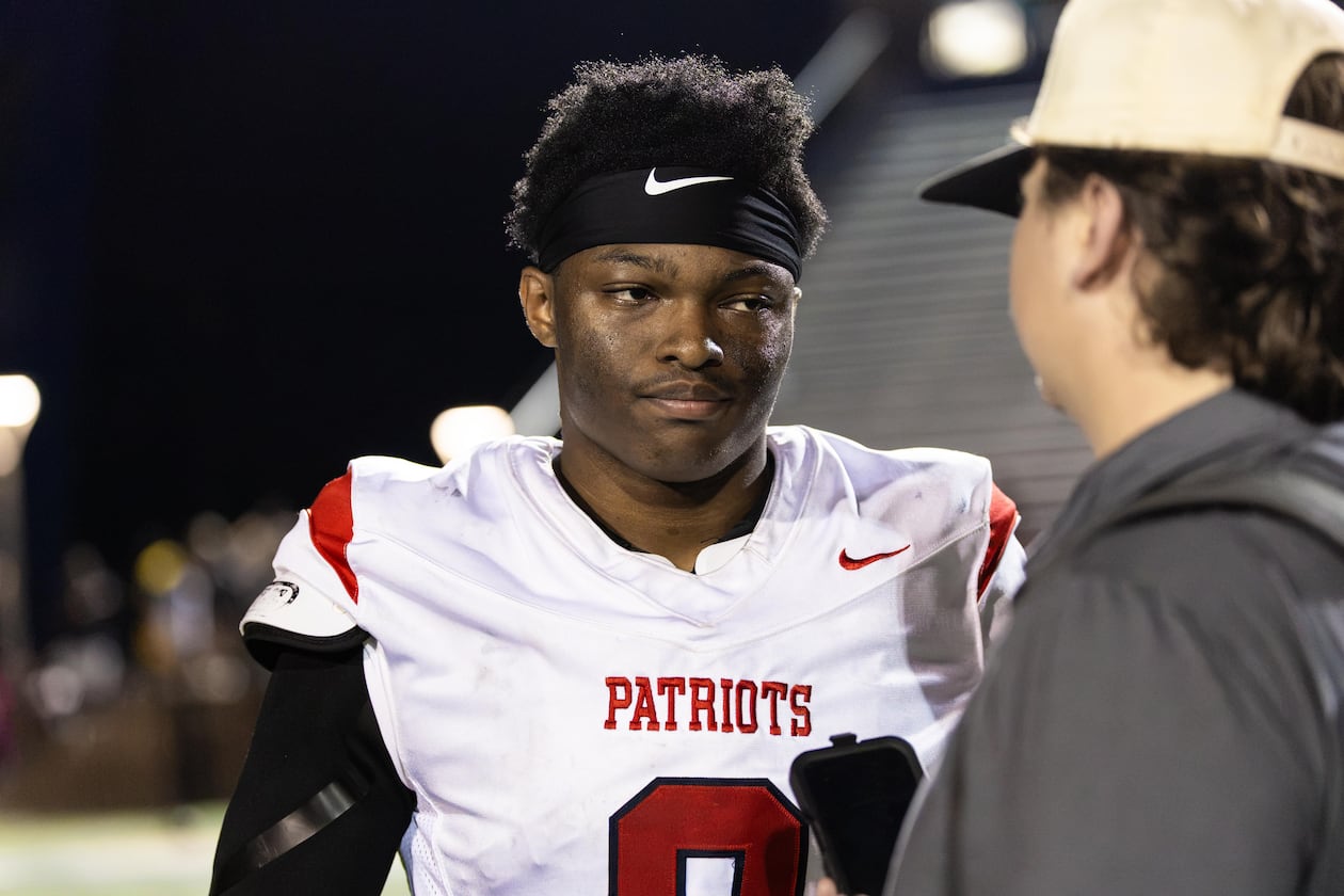 Sandy Creek quarterback Caleb Hill (left) speaks to AJC Varsity reporter Jack Leo after a 21-0 win over Douglas County in August. Sandy Creek is the unanimous No. 1 team in Class 4A, according to the AJC Varsity Composite Rankings, but stands No. 5 in the GHSA Post Season Rankings and is projected to finish as the No. 5 seed, according to the Maxwell Ratings' latest PSR projections. (Oscar Guevara Saenz for the AJC)
