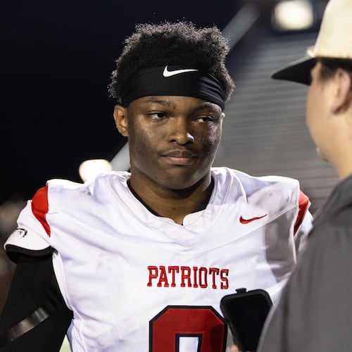 Sandy Creek quarterback Caleb Hill (left) speaks to AJC Varsity reporter Jack Leo after a 21-0 win over Douglas County in August. Sandy Creek is the unanimous No. 1 team in Class 4A, according to the AJC Varsity Composite Rankings, but stands No. 5 in the GHSA Post Season Rankings and is projected to finish as the No. 5 seed, according to the Maxwell Ratings' latest PSR projections. (Oscar Guevara Saenz for the AJC)