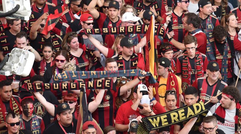 Atlanta United fans walk through inside Mercedes-Benz Stadium before an MLS soccer match on Saturday, Sept. 16, 2017.