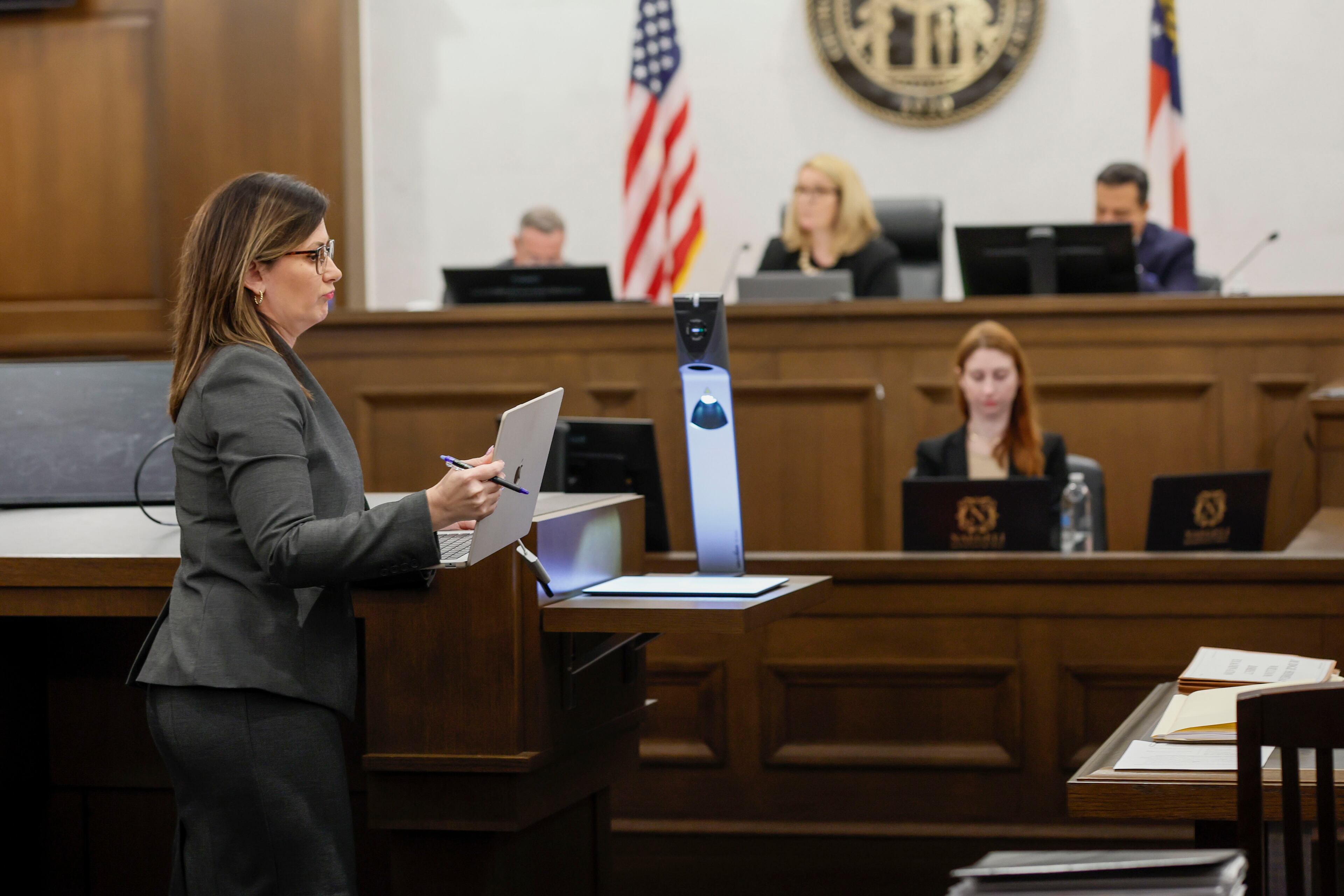 Georgia Judicial Qualifications Commission Director Courtney Veal walks back to her seat after presenting opening statements during the first day of a misconduct trial against Fulton County Superior Court Judge Shermela Williams in Atlanta on Wednesday, May 21, 2025.
(Miguel Martinez/ AJC)