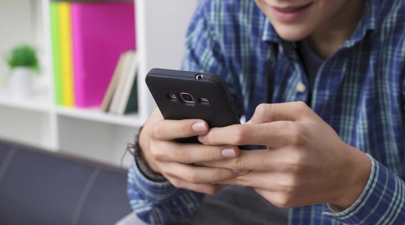 A new mobile app will let Roswell residents report issues and track the cityâs response. DREAMSTIME / TNS / AJC FILE